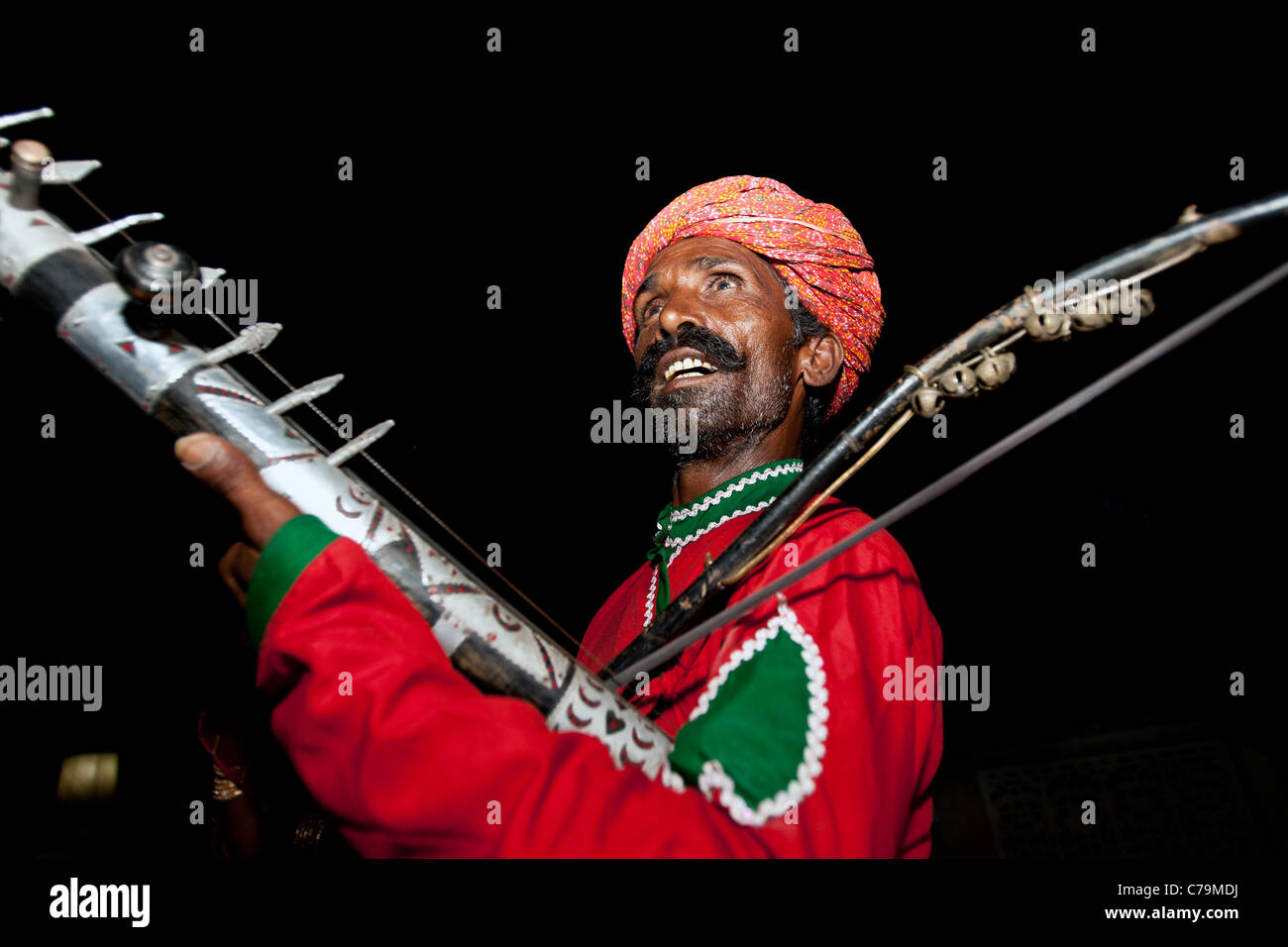 Man plays traditional rawanhattha string instrument Mandawa Rajasthan