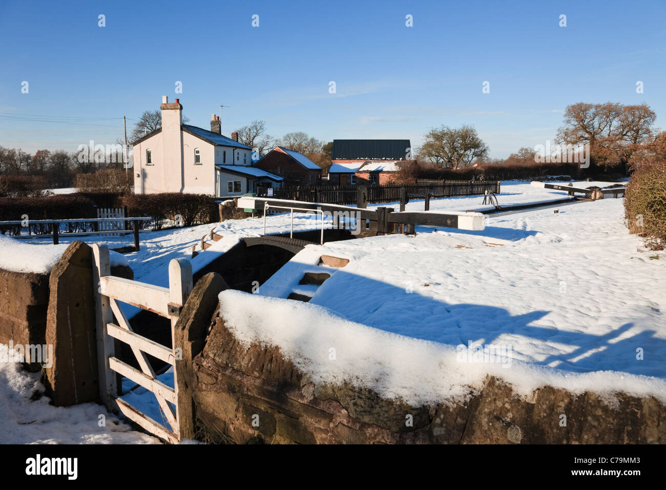 Lock 5 at Bosley locks on the Macclesfield canal with snow in winter. Bosley, Cheshire, England, UK, Britain Stock Photo