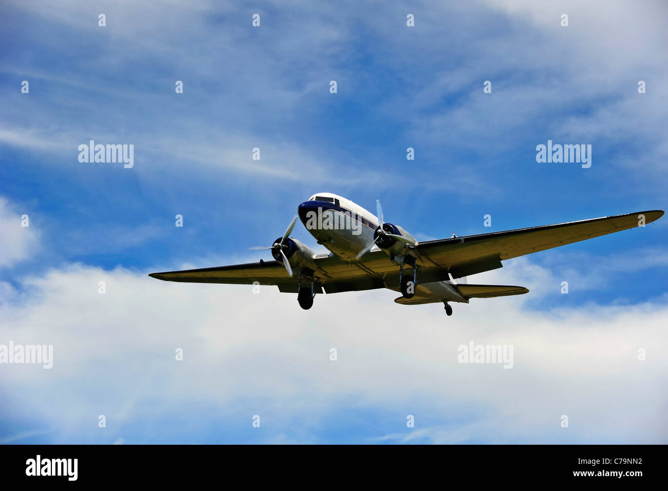 A vintage Douglas DC-3A coming in to land at an airfield Stock Photo