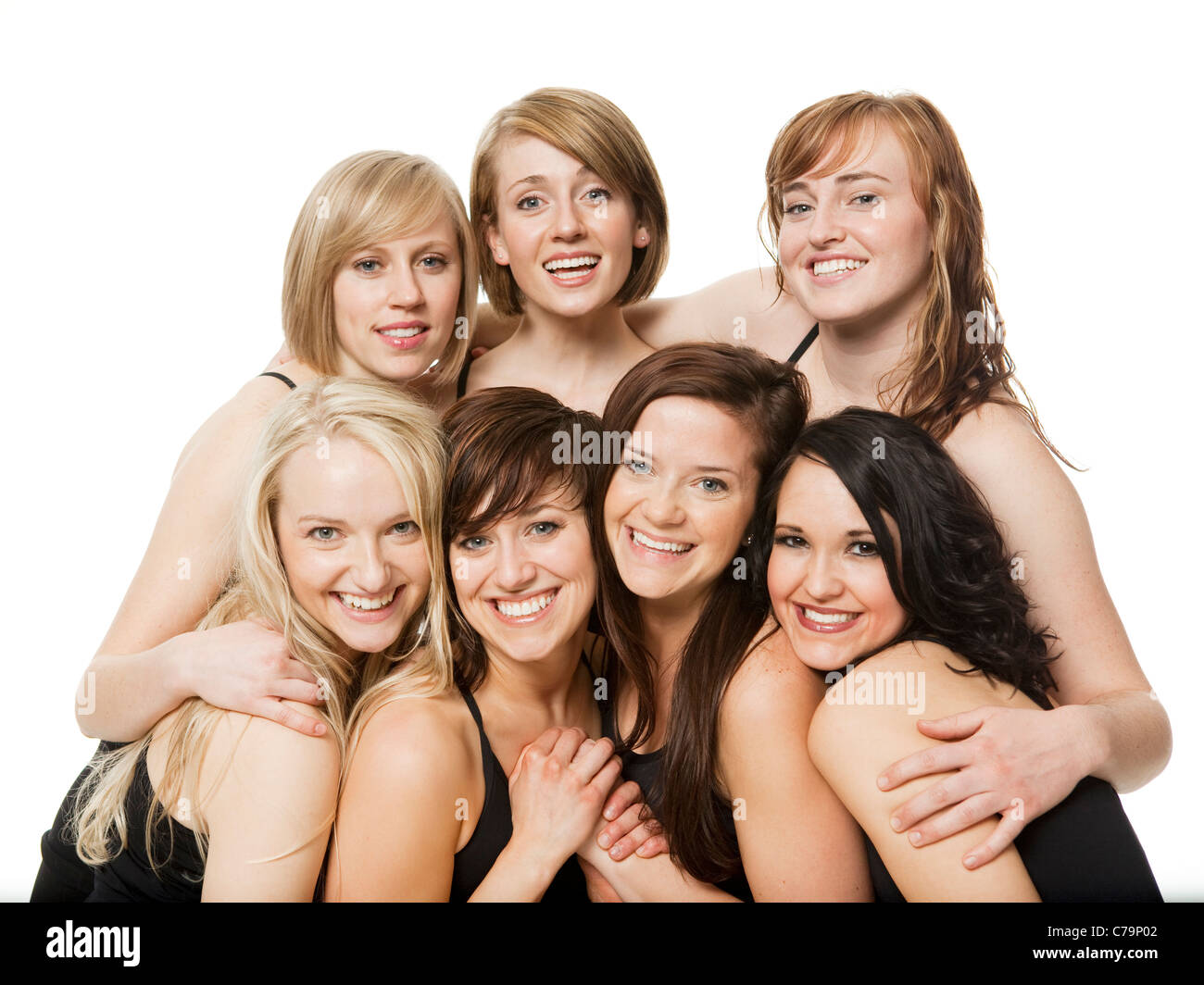Studio shot of happy young women posing together Stock Photo
