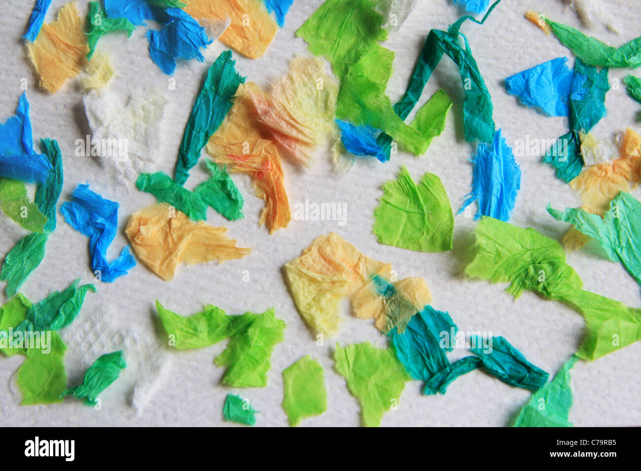 colored tissue paper glued to white paper background Stock Photo