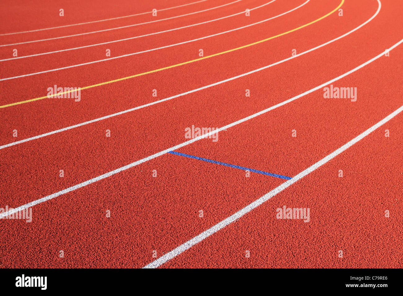 track lanes diagonal and turn to the left on a red rubber track Stock Photo