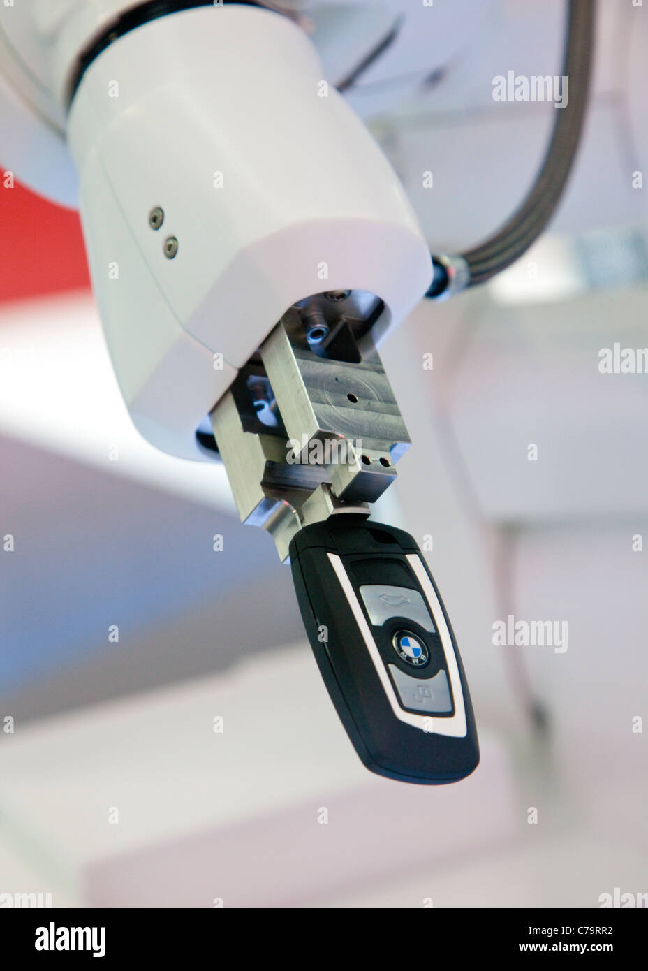 BMW Key held by a robots arm on the IAA 2011 International Motor Show in Frankfurt am Main, Germany Stock Photo