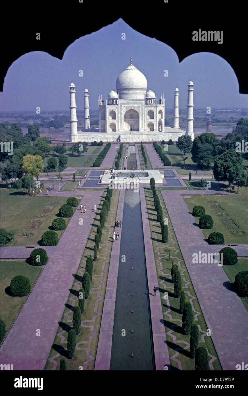 The Taj Mahal is the world-famous white-marble mausoleum built in the mid-1600s in Agra, India, by Mogul emperor Shan Jahan to honor his third wife. Stock Photo