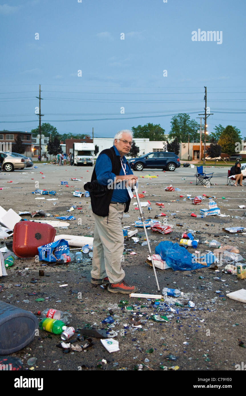 Older Man Standing Amid Trash Left in Parking Lot near Churchill Downs