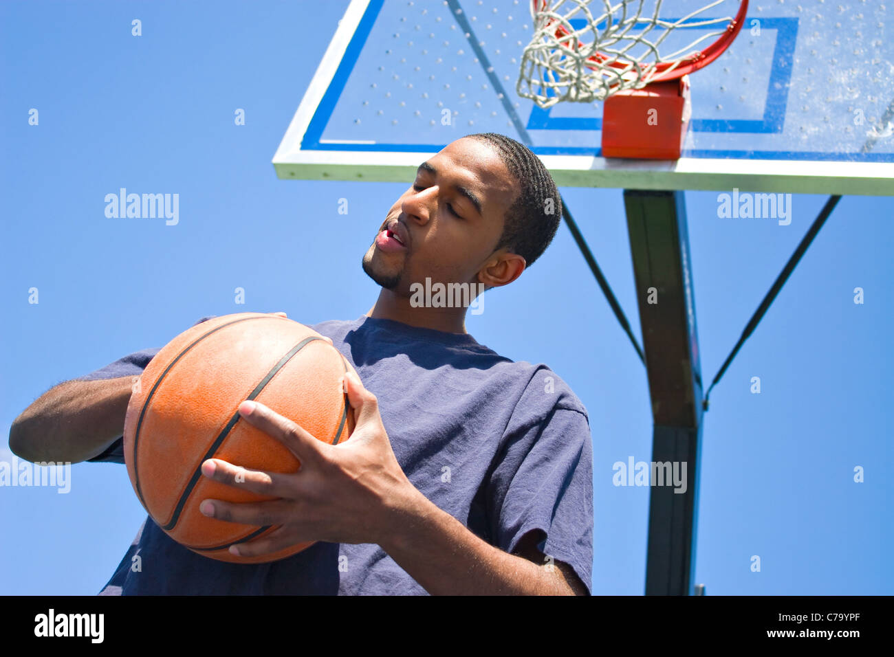 Depressed Male Basketball Player With Basketball Stock Photo, Picture and  Royalty Free Image. Image 106511707.