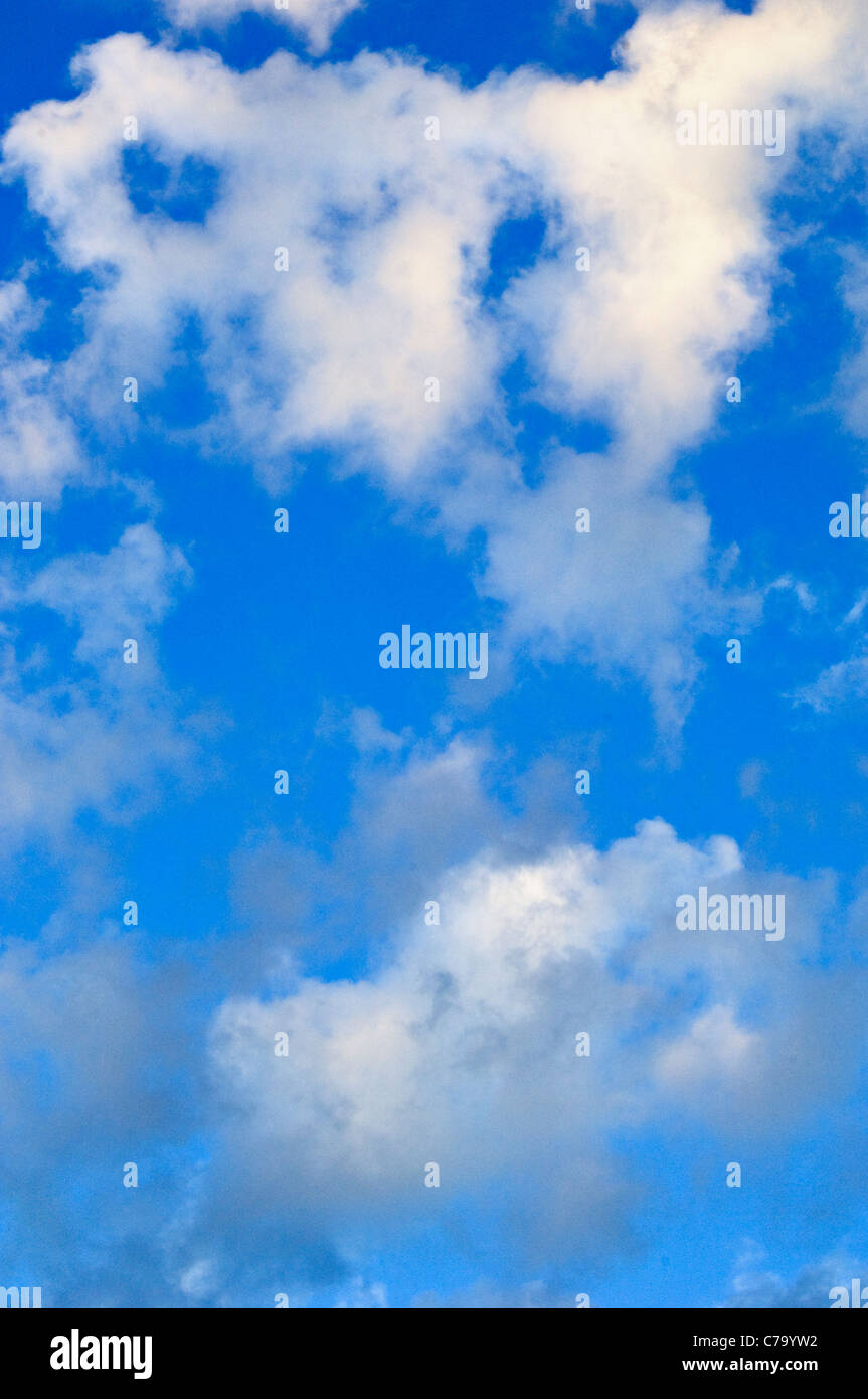 White Cumulus Clouds in a Blue Sky Stock Photo