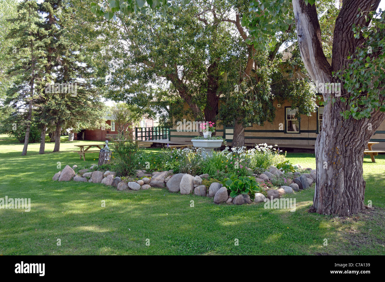 An old western railway station grounds and gardens located in Big Valley, Alberta, Canada. Stock Photo