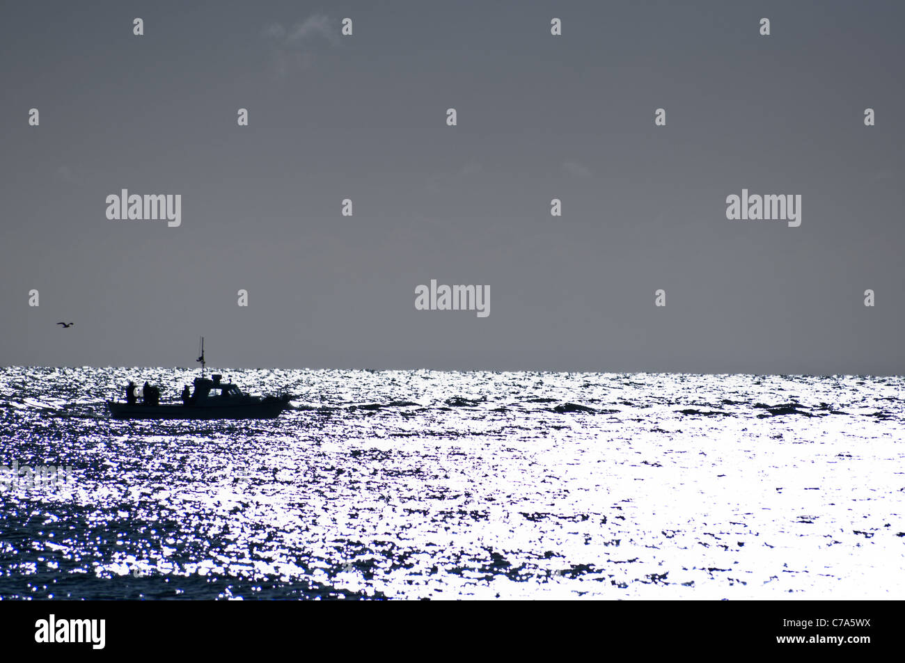 small inshore fishing boat sun shine north sea Stock Photo