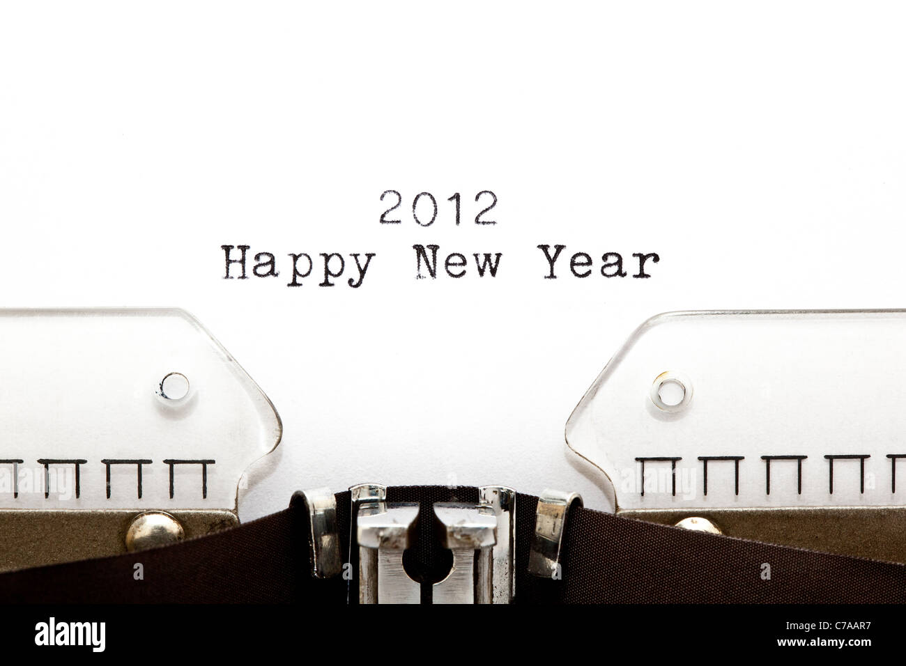 Concept image with 2012 HAPPY NEW YEAR written on an old typewriter Stock Photo