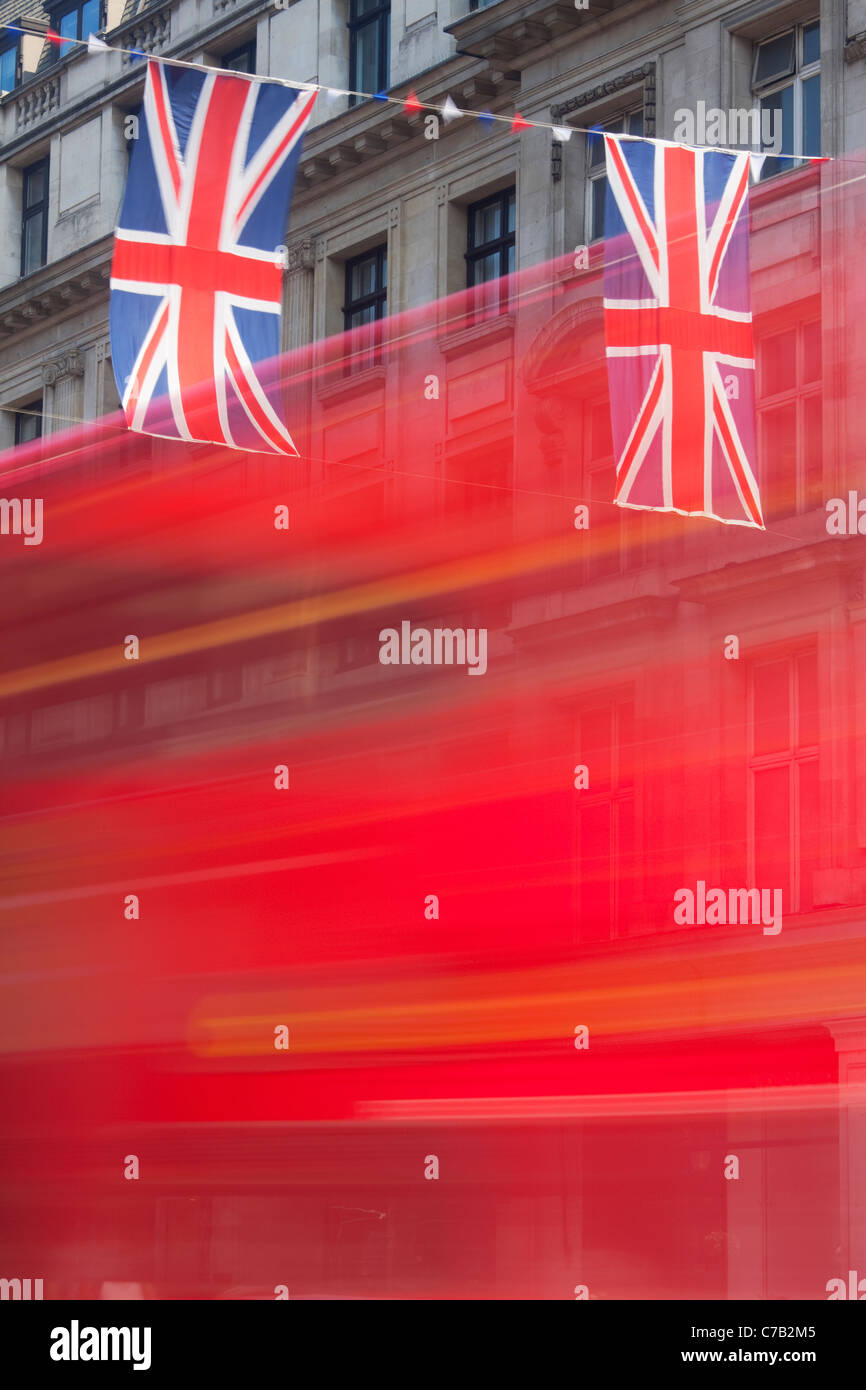 Red bus and Union Jack Flags Regent Street London Stock Photo