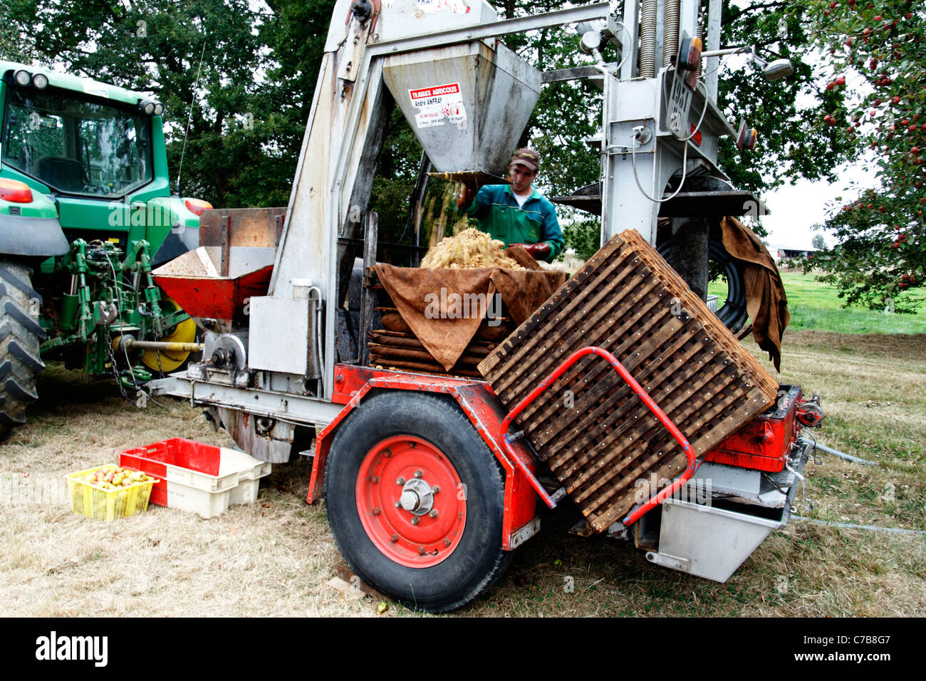 Pressing apples to make cider, hydraulic press (Normandy, France). Stock Photo