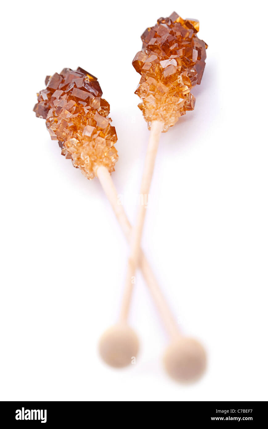 Brown amber sugar crystal on wood stick Stock Photo