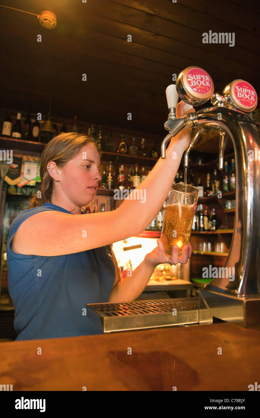 Pouring another beer, Peter's Cafe Sport, Horta, Faial, Azores : legendary trans-Atlantic sailors' Watering Hole Stock Photo