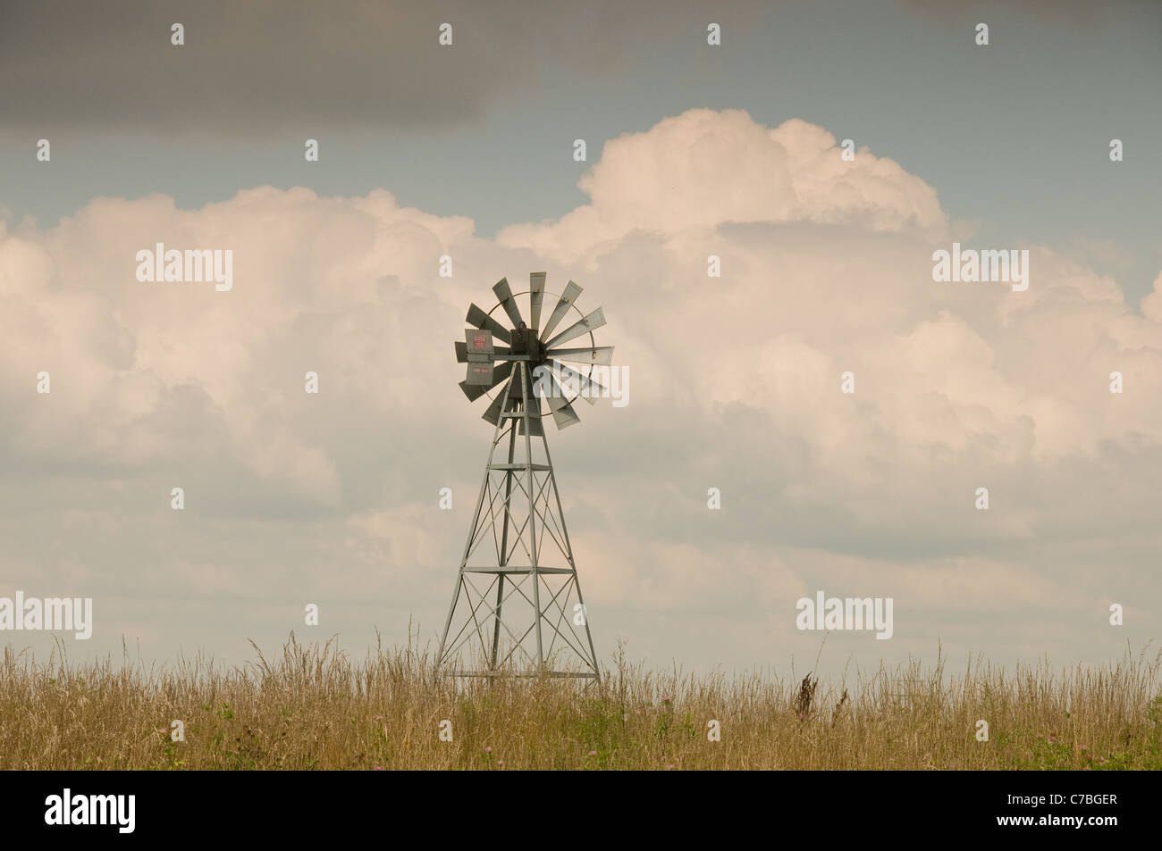 Windmill and tower with metal blades on Ohio Farm Stock Photo