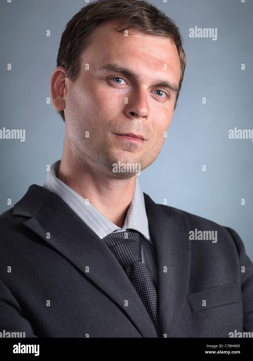Portrait of a man wearing a gray suit Stock Photo - Alamy