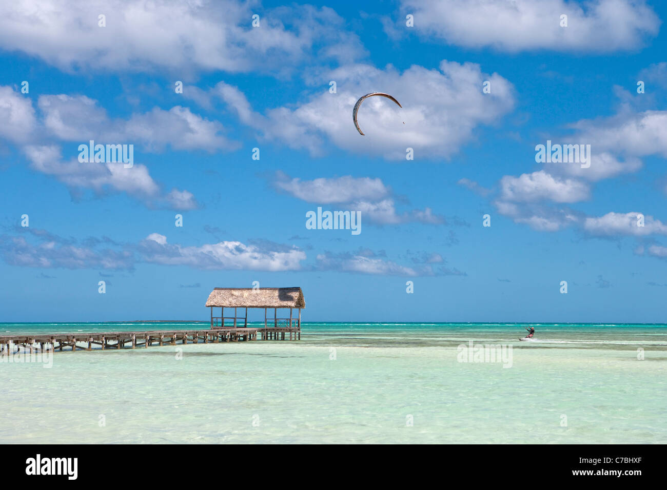 Pier and kitesurfer in lagoon, Cayo Guillermo (Jardines del Rey), Ciego de Avila, Cuba Stock Photo