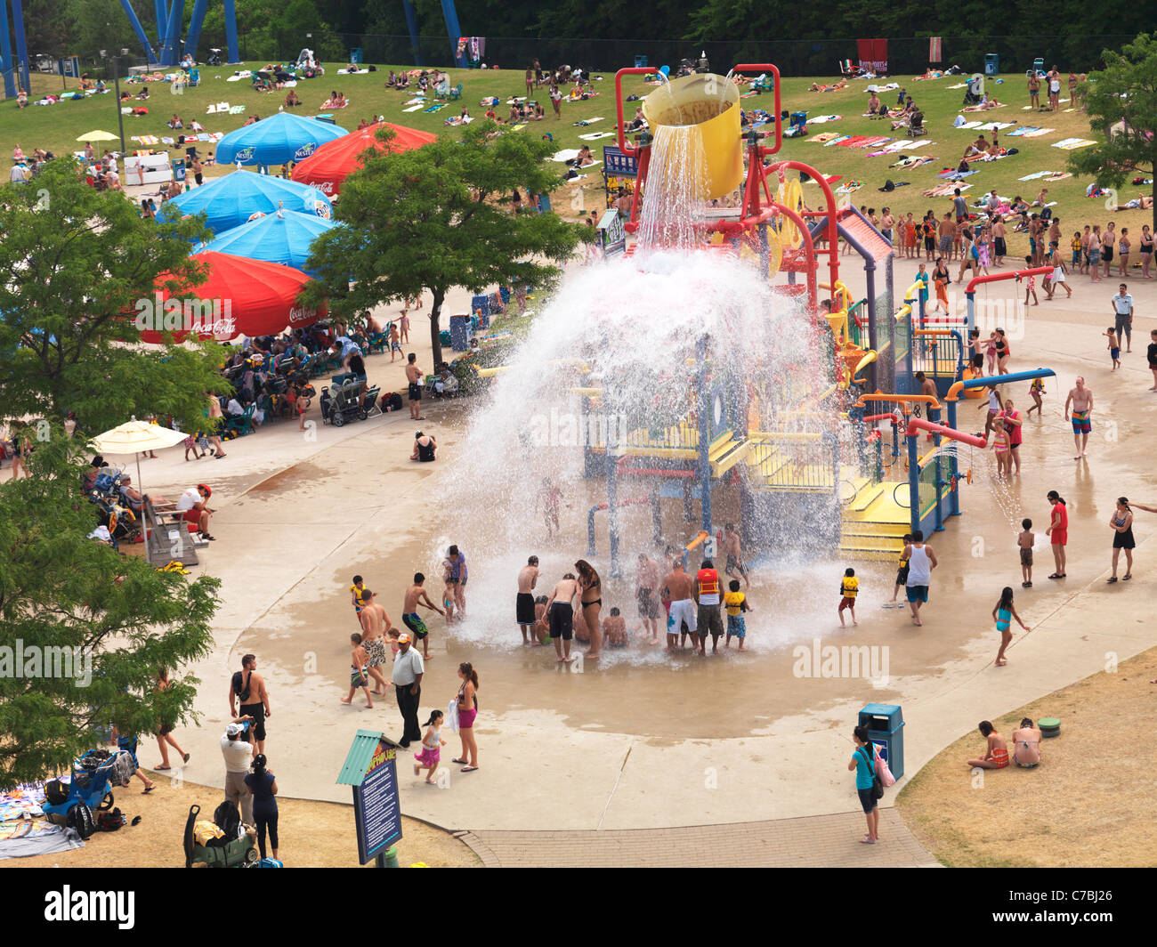 People being splashed with water at a water park's pump house at Canada