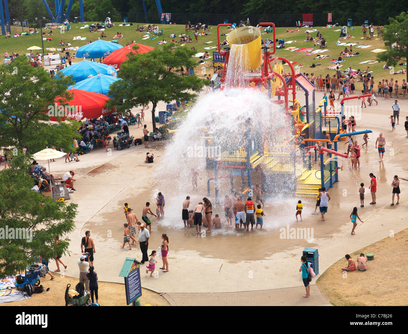 People being splashed with water at a water park's pump house at Canada's Wonderland amusement park. Vaughan, Ontario, Canada Stock Photo