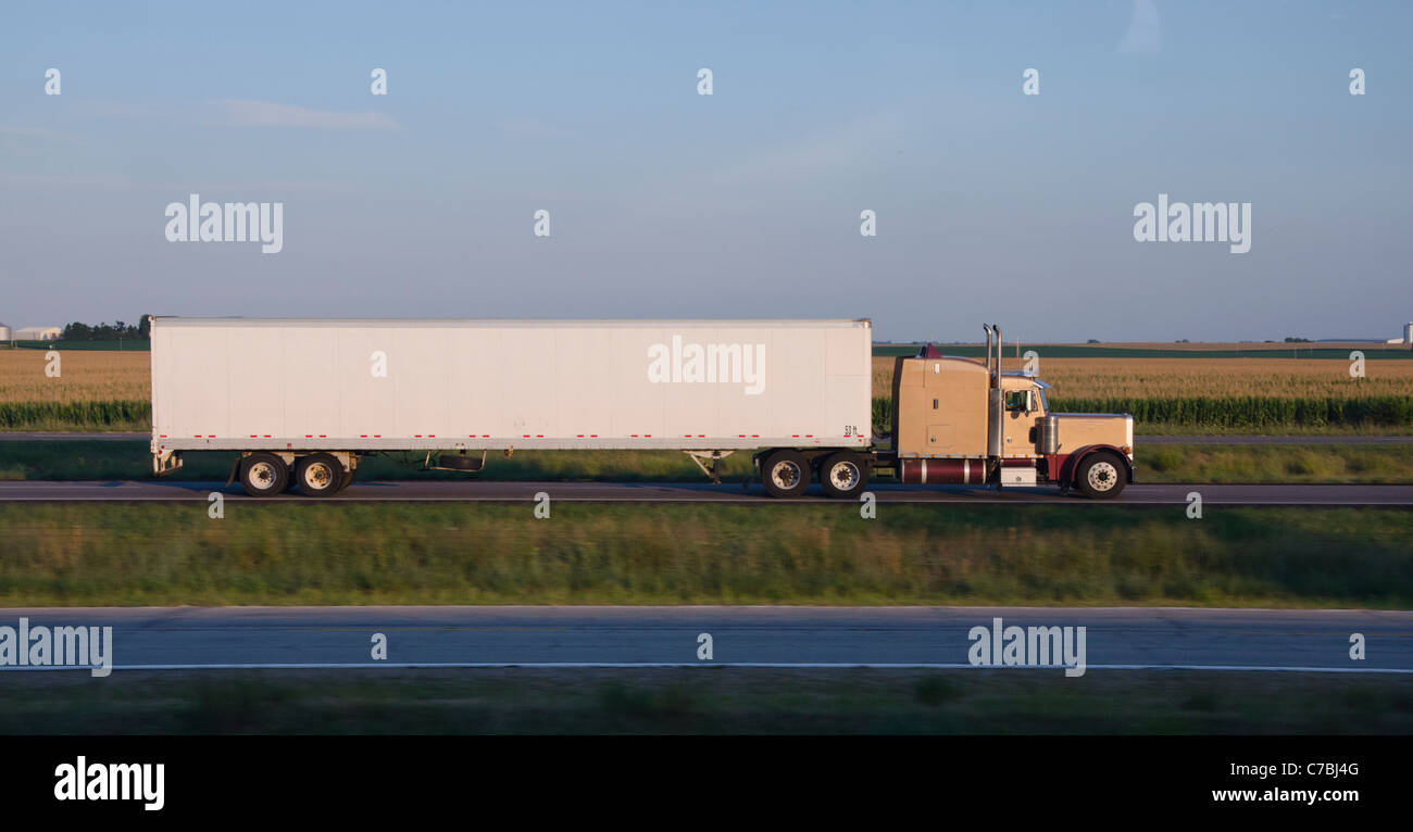 Truck driving down road in Illinois Stock Photo