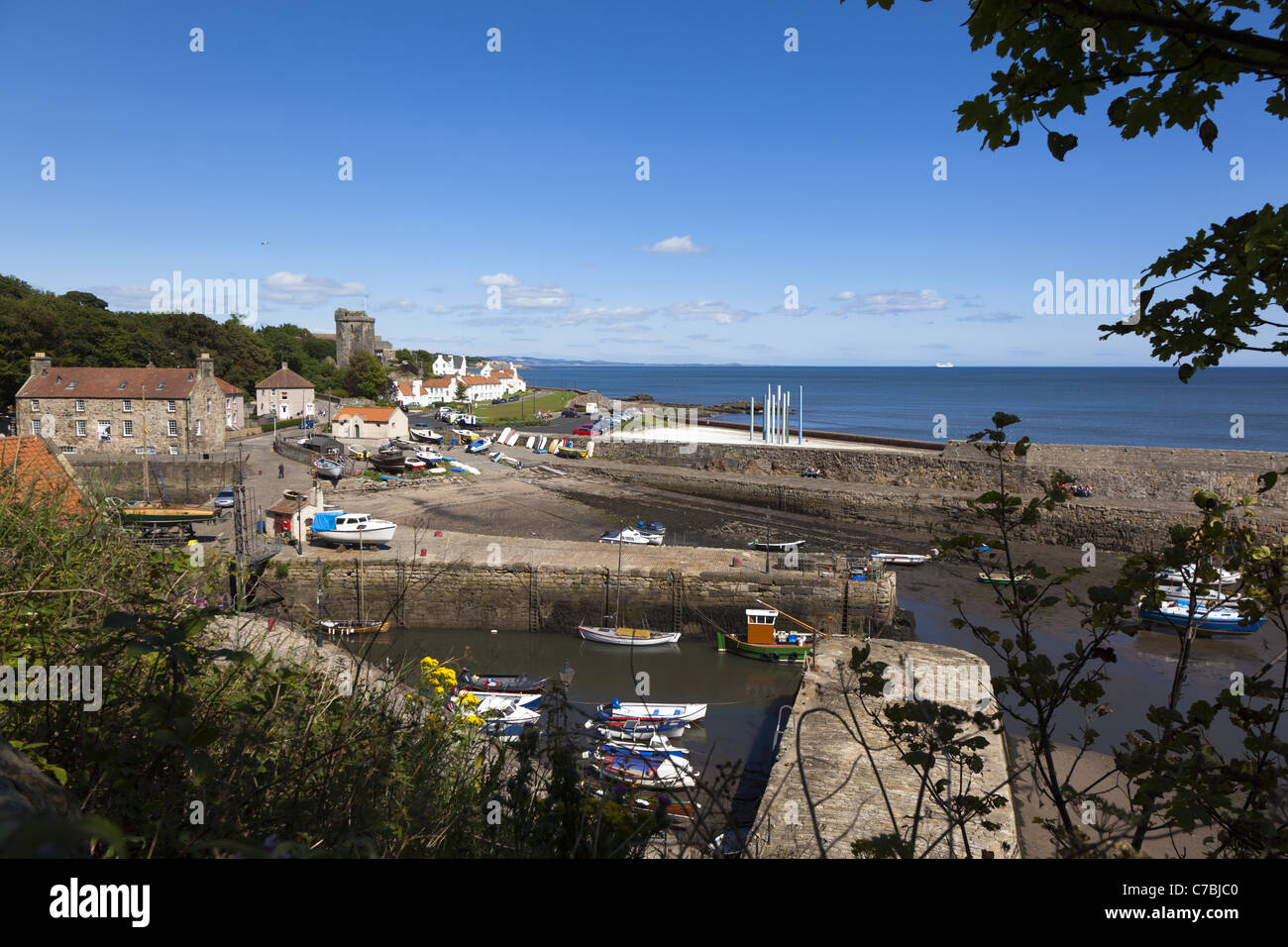 Dysart Harbour near Kirkcaldy in Fife, Scotland showing the Harbourmaster's House and the remains of St Serf's Church. Stock Photo