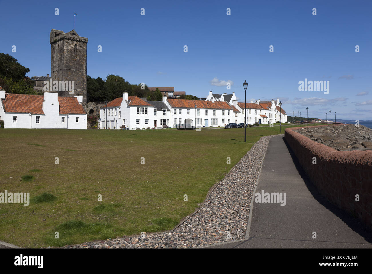 Neat row of white cottages known as Pan Ha' (Pan Haugh) and  St Serf's tower at Dysart, Kircaldy, Fife, Scotland Stock Photo