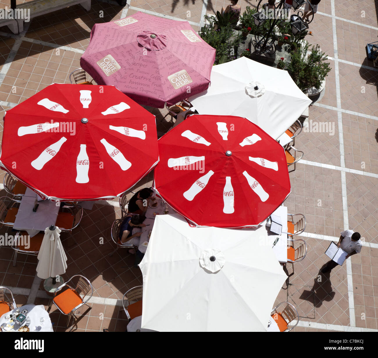 Looking down from the Plaza de la Paz on to diners under sun umbrellas, Mijas, Andalucia, Spain Stock Photo