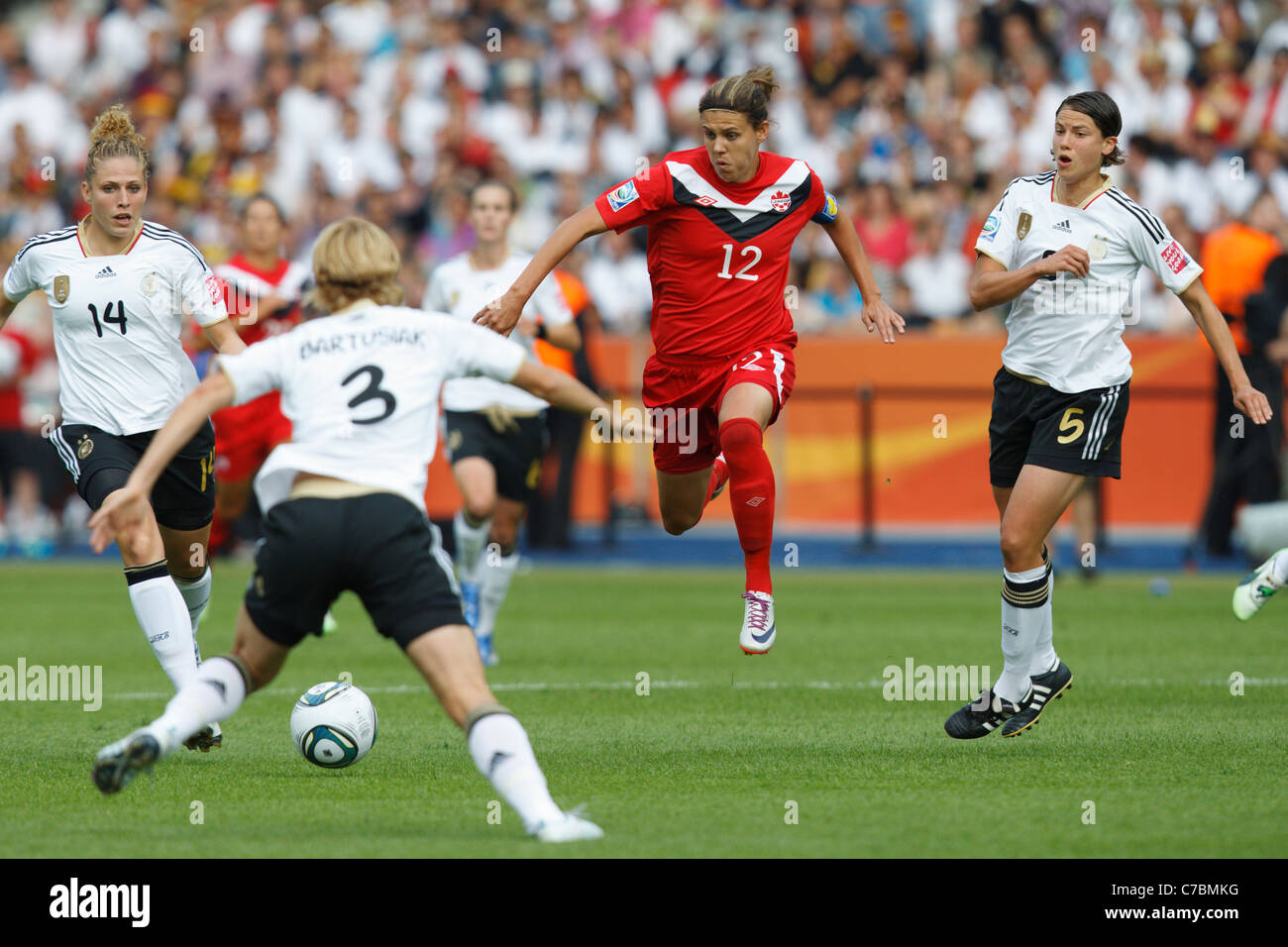 BERLIN - JUNE 26:  Canada team captain Christine Sinclair (12) in action against Germany during the opening match of the FIFA Women's World Cup soccer tournament on June 26, 2011 at Olympiastadion in Berlin, Germany. Editorial use only. Commercial use prohibited. (Photograph by Jonathan Paul Larsen / Diadem Images) Stock Photo