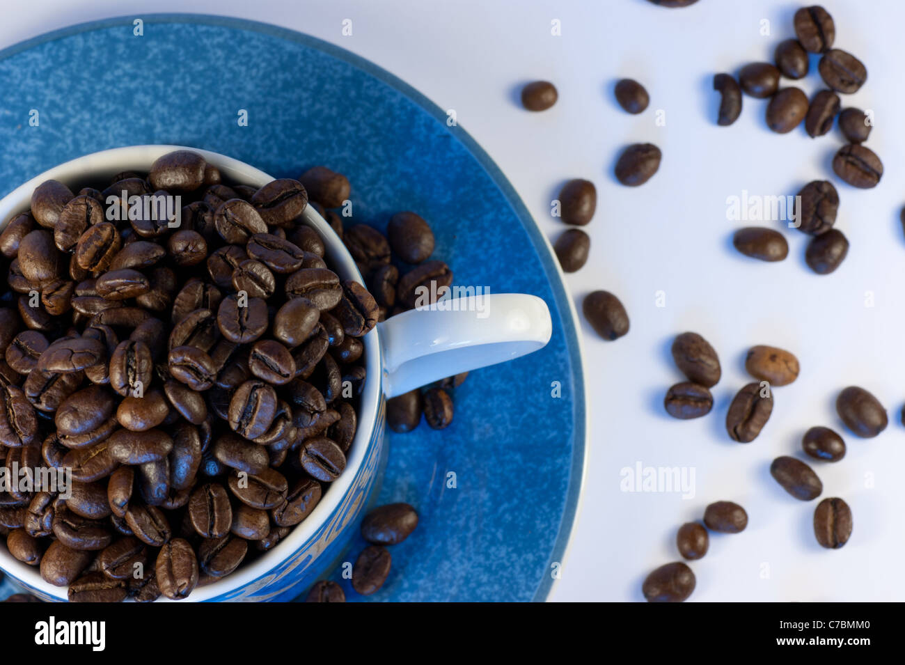 A cup of dark roasted coffee beans Stock Photo - Alamy