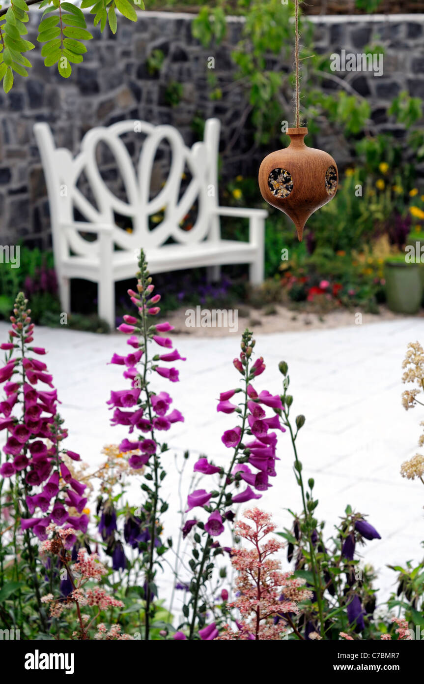 Wooden Wood Fancy Bird Feeder In Garden With White Painted Wooden