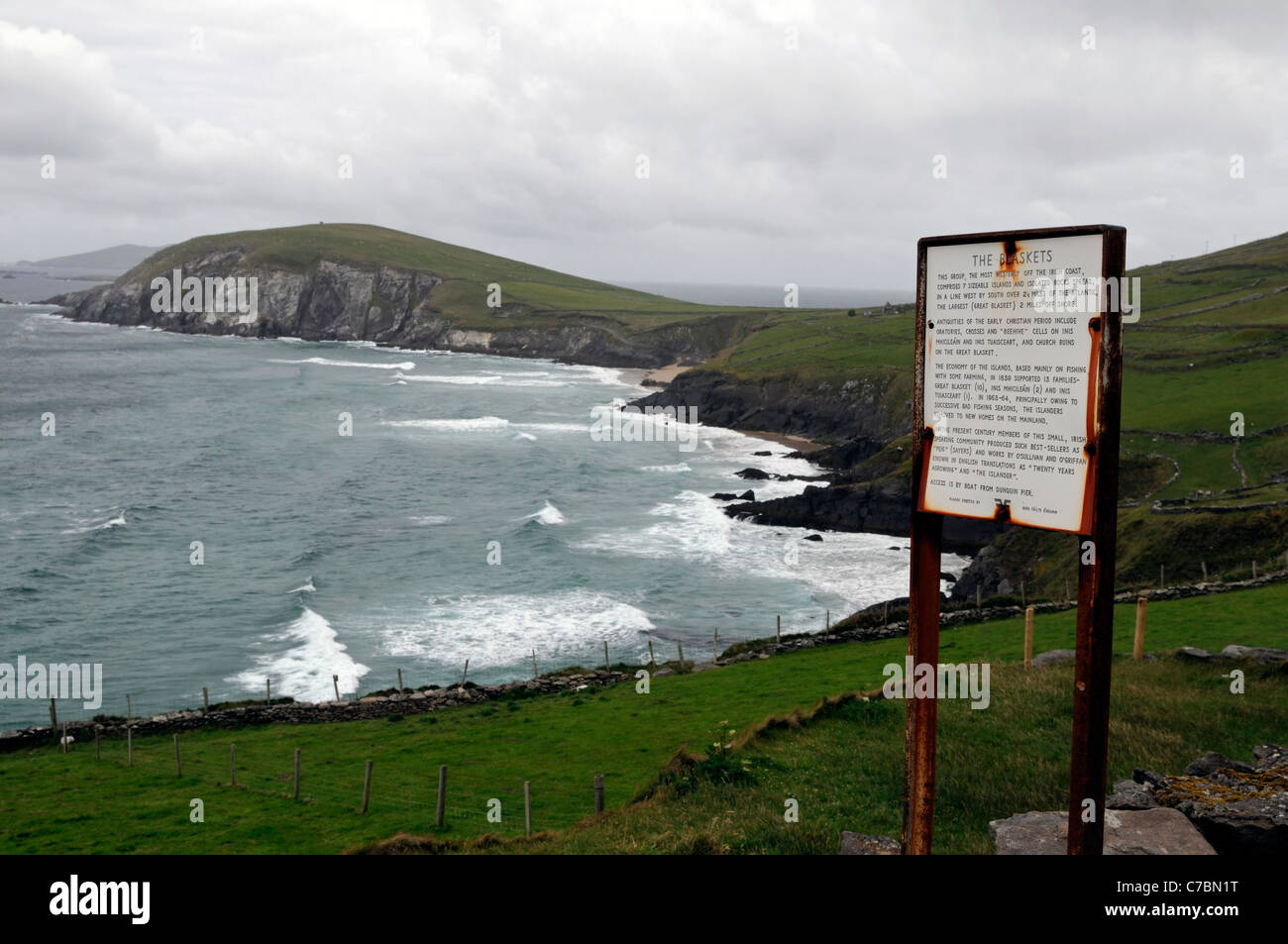 sign for blasket islands with slea head in background stormy day coast coastline Dingle peninsula County Kerry Ireland Stock Photo