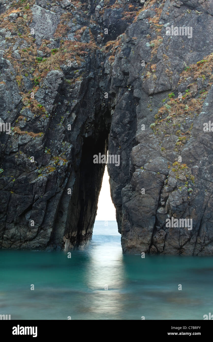 Triangular passage in sea stack, Harris Beach State Park, Brookings, Oregon, USA, North America Stock Photo