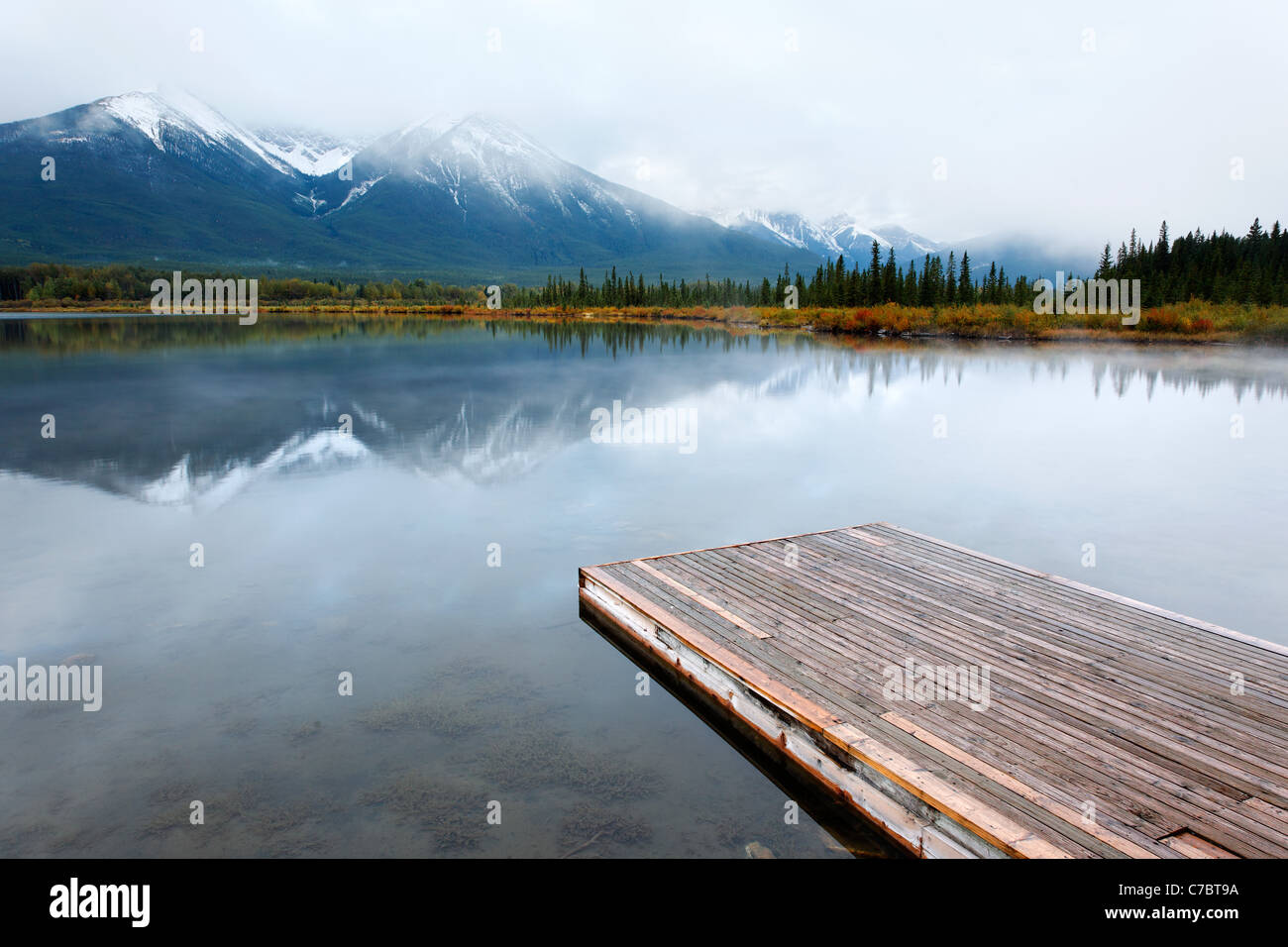 Banff Dock Wood dock floating on Vermillion Lakes on a still morning, Banff ...