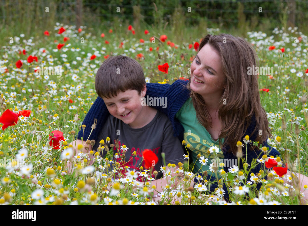 Children Playing in a Meadow; Cornwall; UK Stock Photo