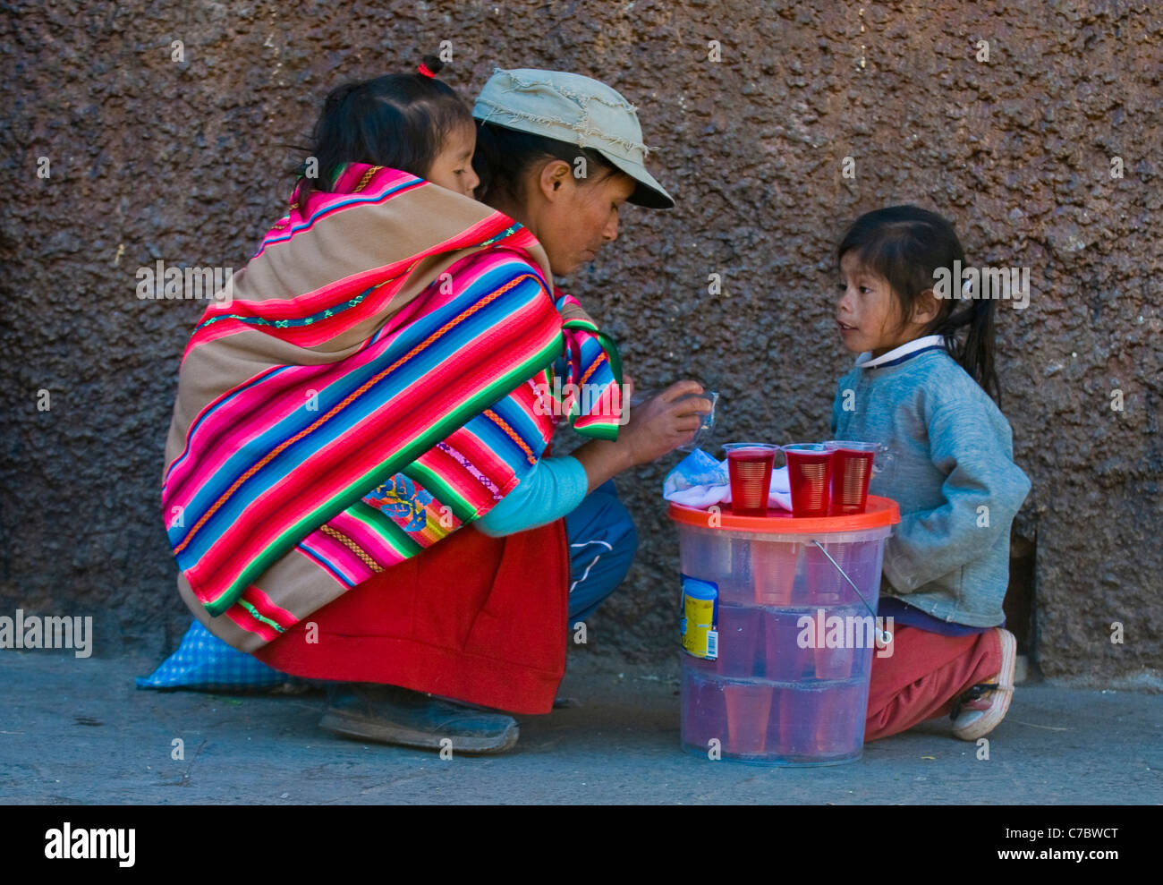 Peruvian woman with here child in a market in Cusco Peru Stock Photo