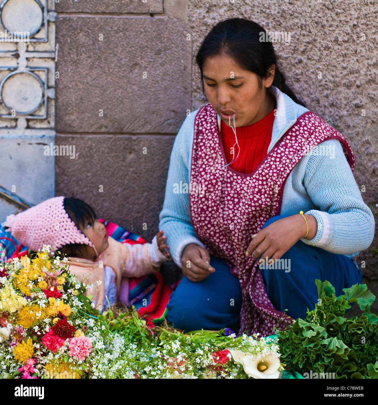 Peruvian woman with here child in a market in Cusco Peru Stock Photo
