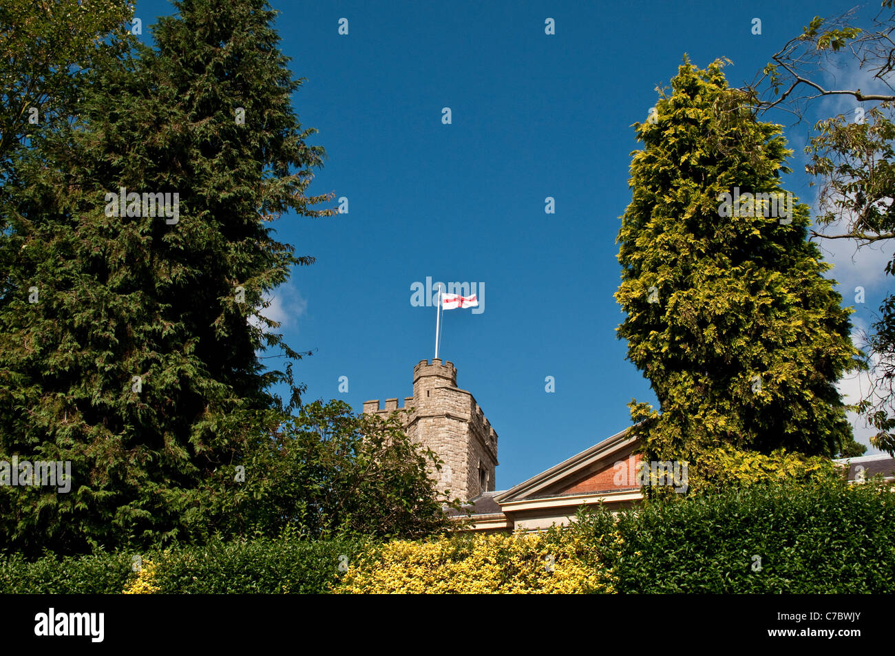 Union Jack waving in the wind on the tower of St Mary’s Parish Church, Twickenham, Middlesex, England, United Kingdom Stock Photo