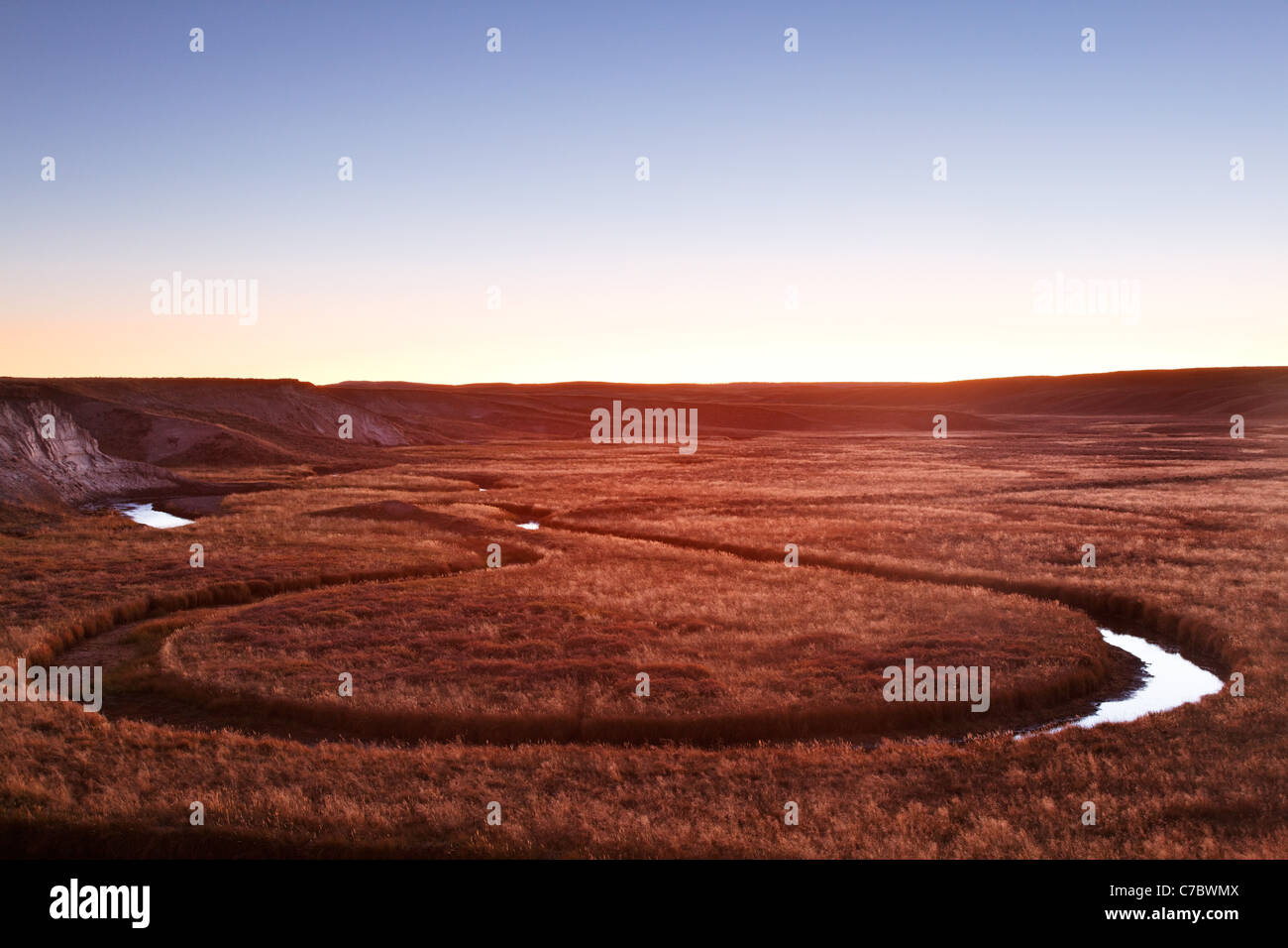 Trout Creek winding through meadows at sunset, Hayden Valley