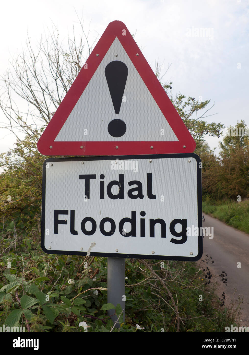 Sign showing road liable to tidal flooding Stock Photo