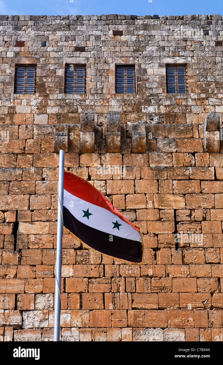 Syrian flag flying outside Krak Des Chevaliers, crusader castle, Syria Stock Photo