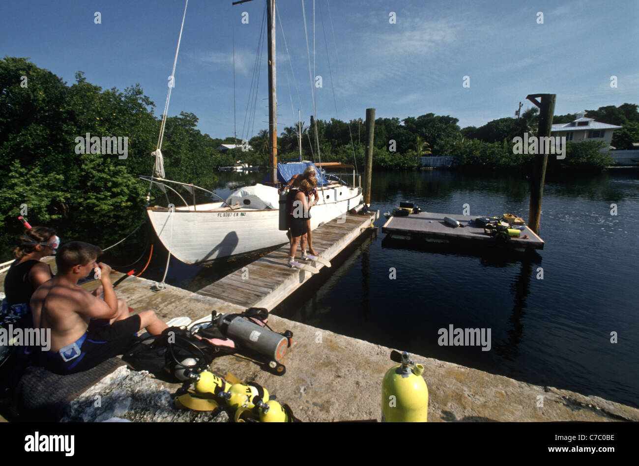 Divers prepare to enter the water at the Jules Underwater Lodge, the world's only hotel located completely underwater Stock Photo