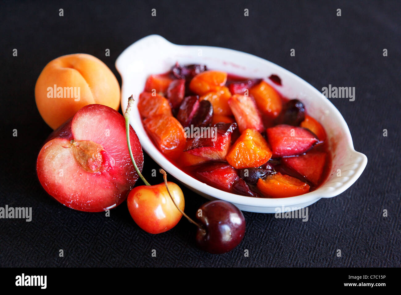Stone fruits baked in ramekin with lavender, by pastry chef Laurie Pfalzer, Pastry Craft Stock Photo