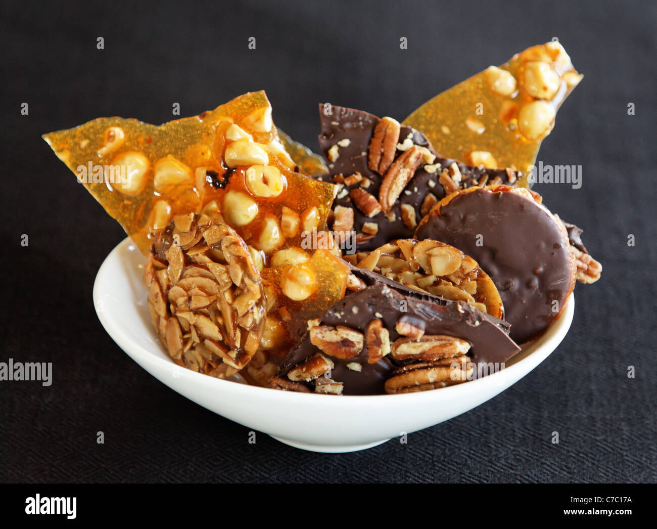 Hazelnut brittle, almond Florentines and chocolate pecan bark in a bowl
