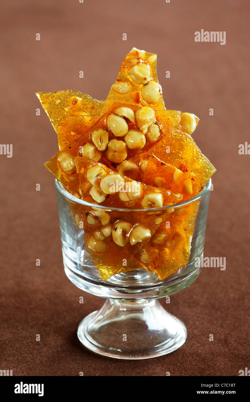 Hazelnut, rosemary and orange brittle in a bowl, by pastry chef Laurie Pfalzer, Pastry Craft Stock Photo