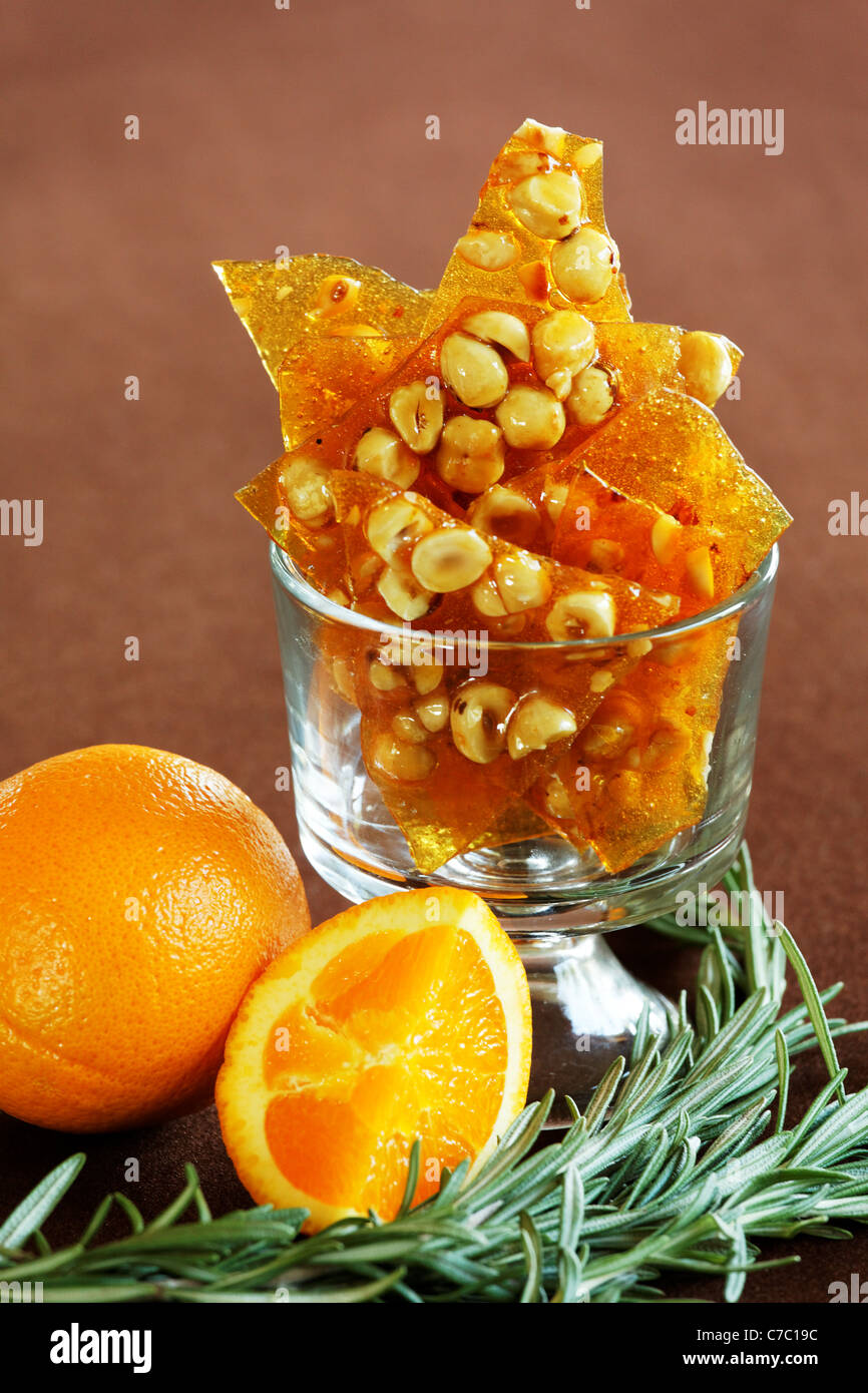 Hazelnut, rosemary and orange brittle in a bowl, by pastry chef Laurie Pfalzer, Pastry Craft Stock Photo