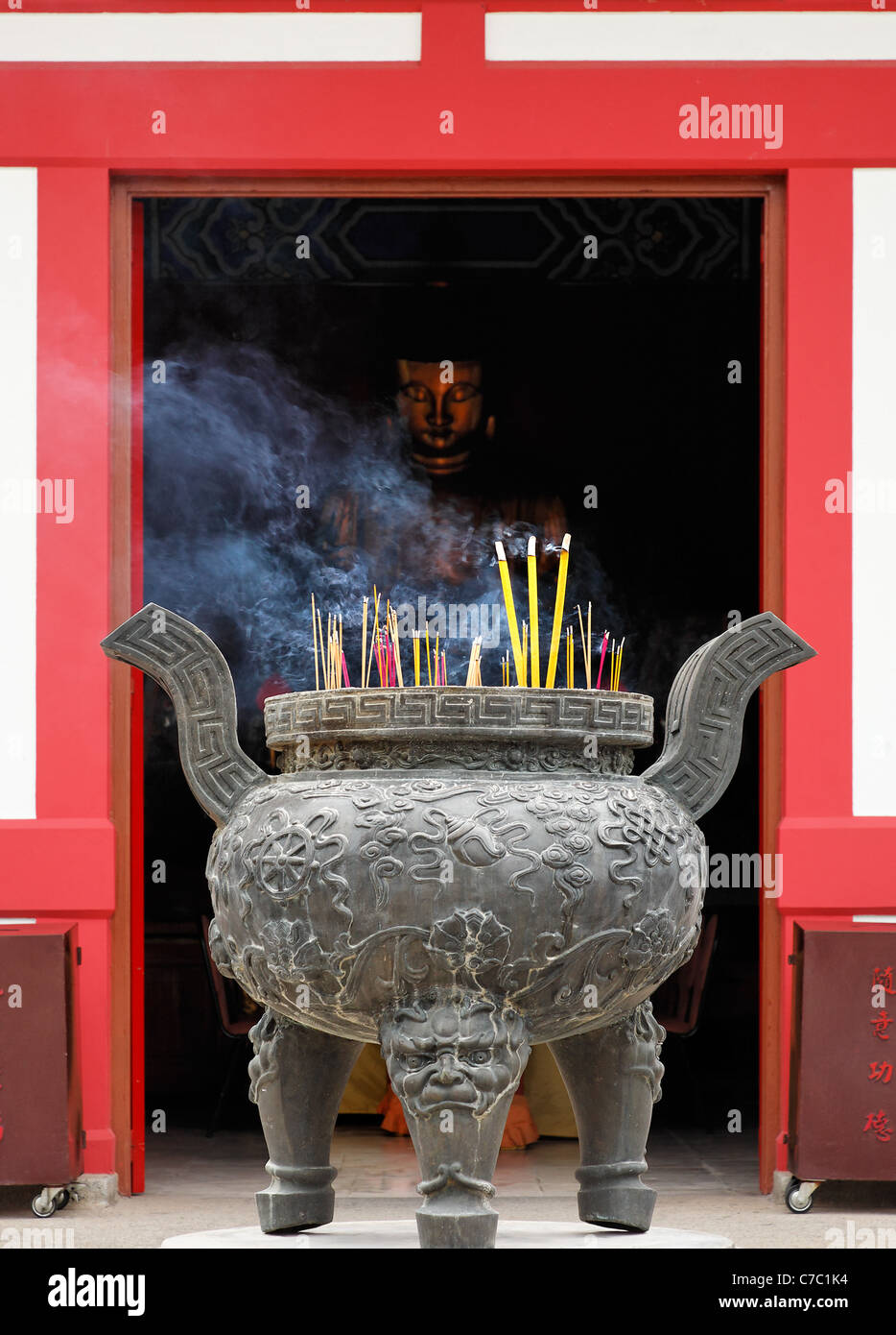 Incense burning in cauldron outside Buddhist temple in Po Fook Hill