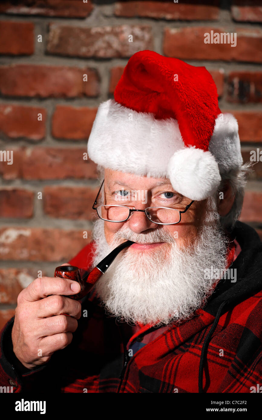 Santa Claus with pipe Stock Photo