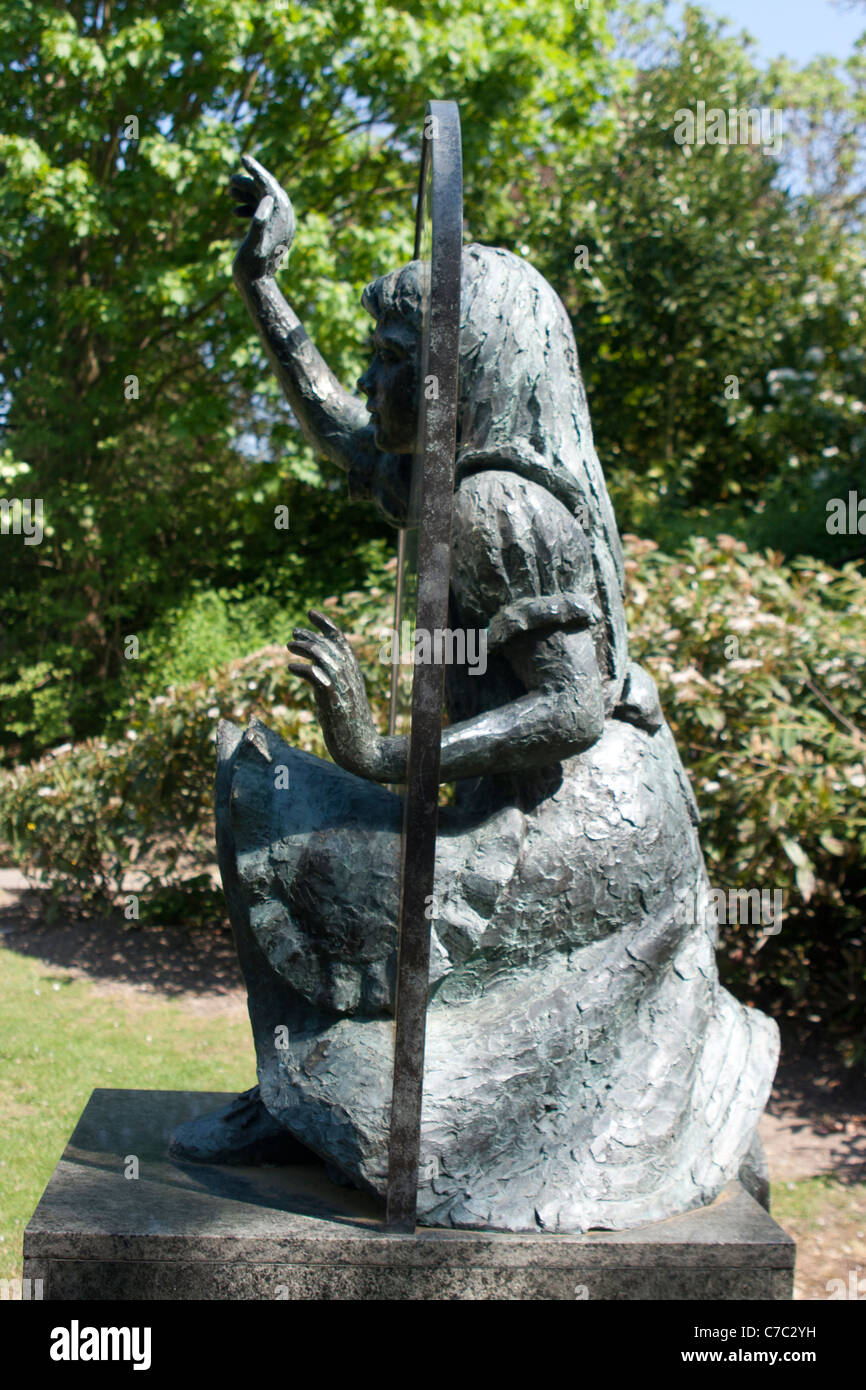 Bronze sculpture of Alice through the looking glass, Castle grounds, Guildford, Surrey Stock Photo