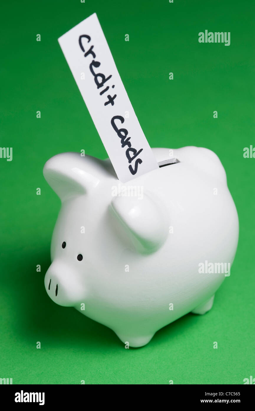 Piggy banks bills coming out hires stock photography and images Alamy