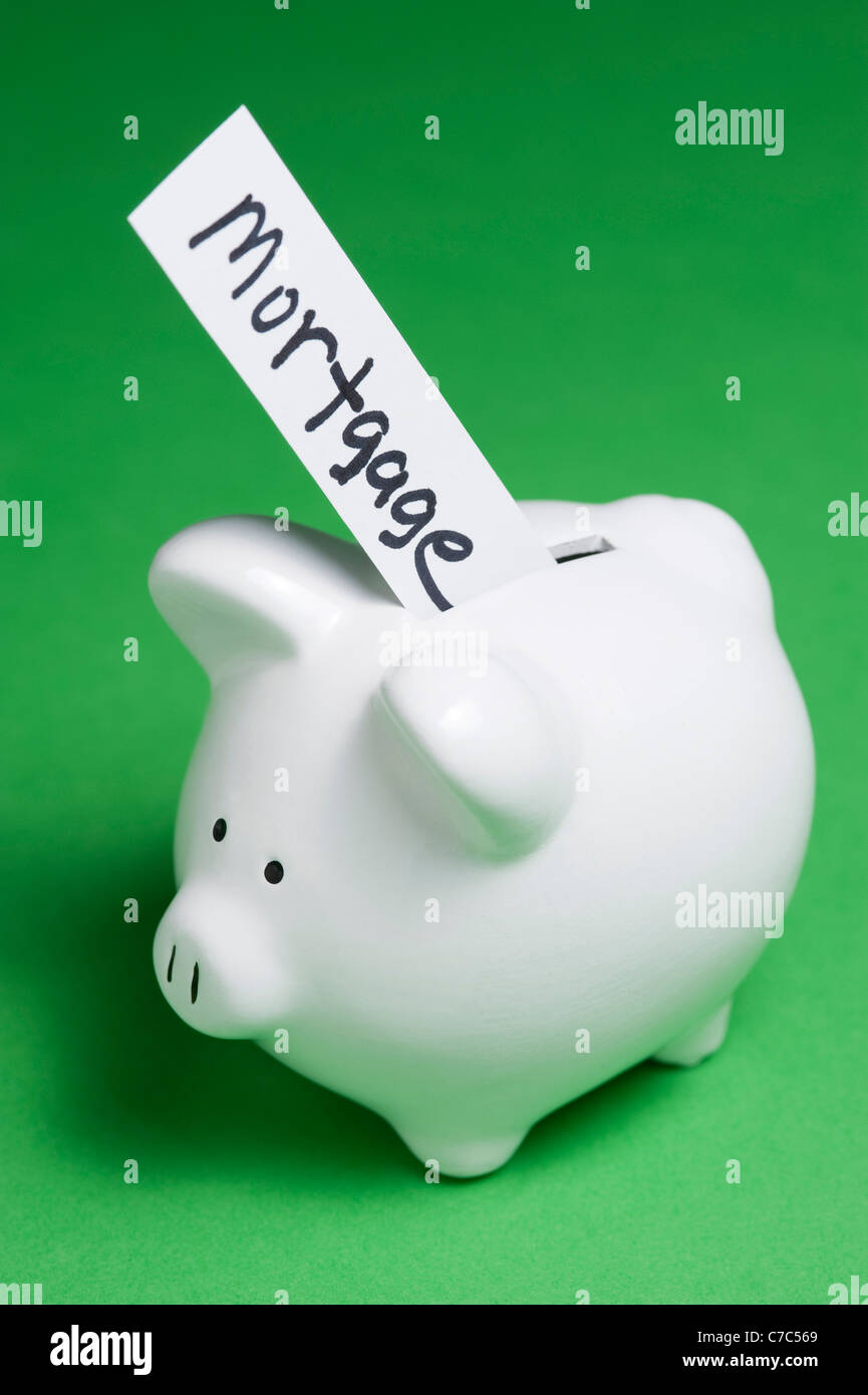 Piggy banks bills coming out hires stock photography and images Alamy